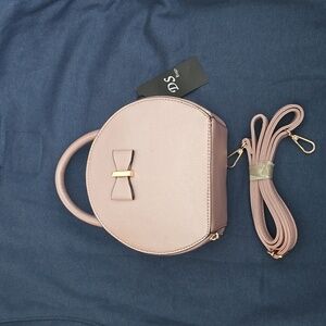 Pale pink metallic round handbag